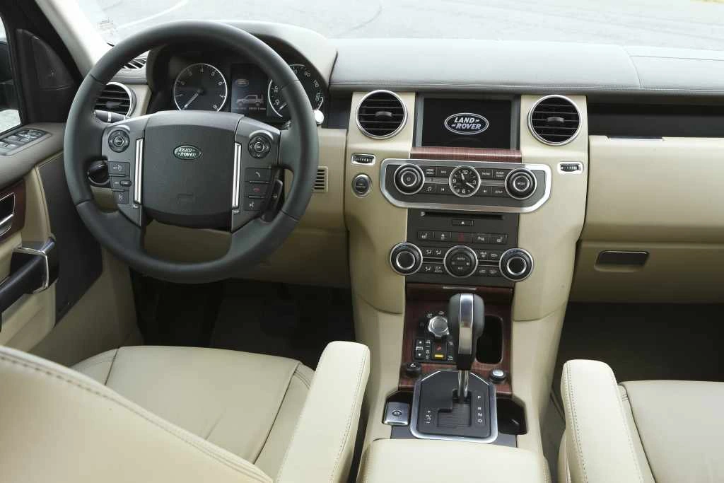 A period Discovery 4 / LR4 cabin; controls vary by engine and market