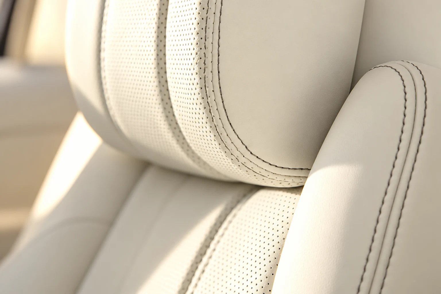 Ivory leather, perforation and twin stitching