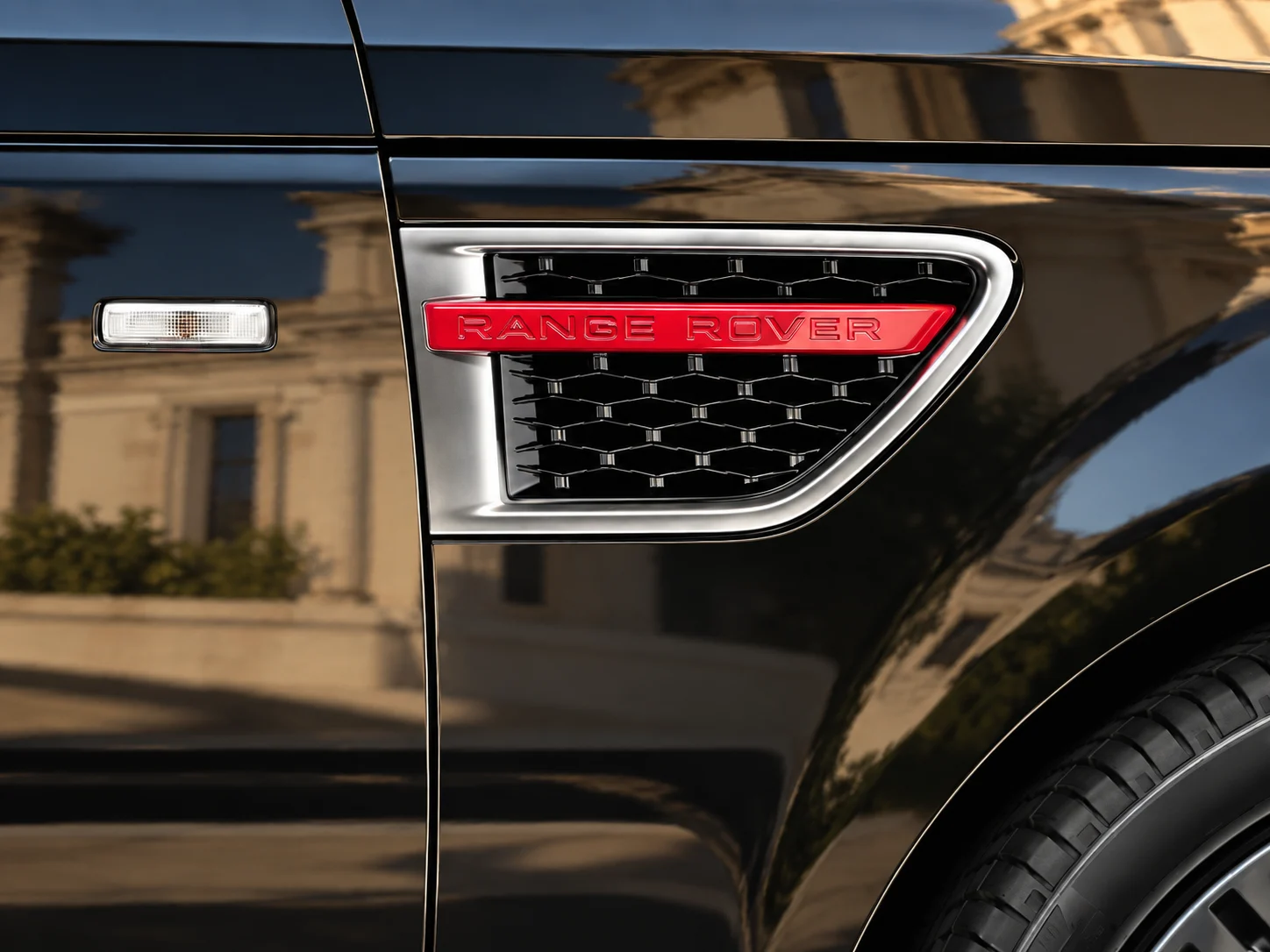 Red RANGE ROVER detail in the side vent